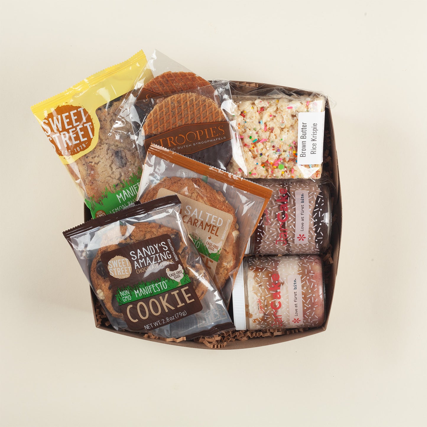 Pennsylvania cookie lover's gift box with three Sweet Street bakery cookies, chocolate stroopwafels, festive Rice Krispie & Lancaster Cupcake jarcakes.