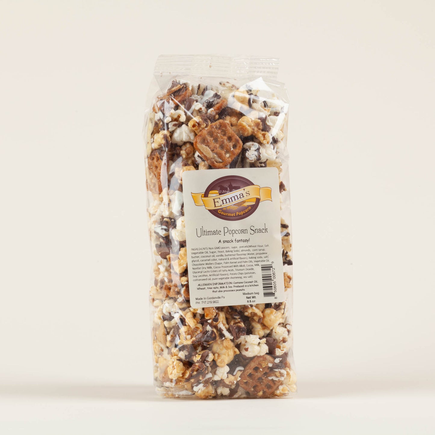 Medium bag of Emma's Ultimate Popcorn Snack on a light background, toffee and sweet-salty popcorn with triple chocolate drizzle and potato chips, made in Lancaster County, PA.