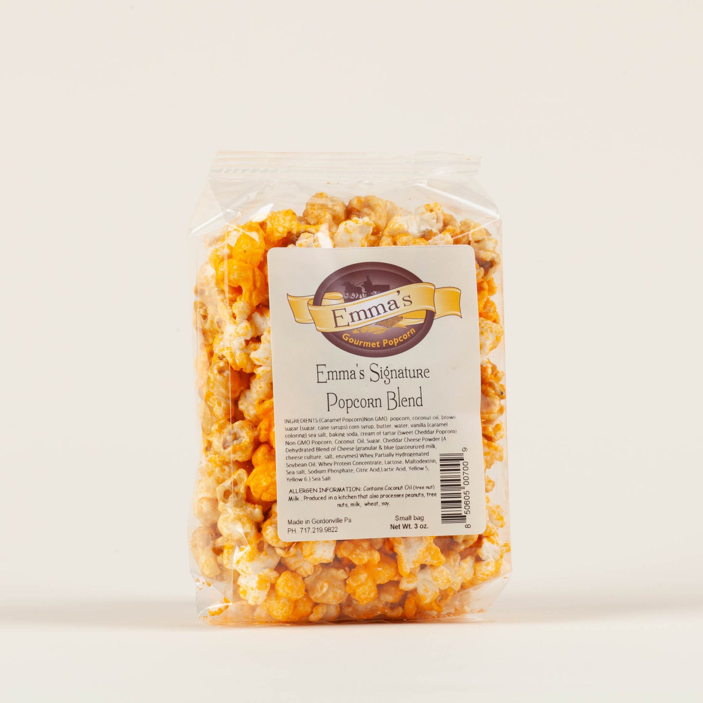 Small bag of Emma's Signature Cheddar and Caramel popcorn on a light background, small-batch non-GMO popcorn made in Gordonville, Lancaster County, PA.