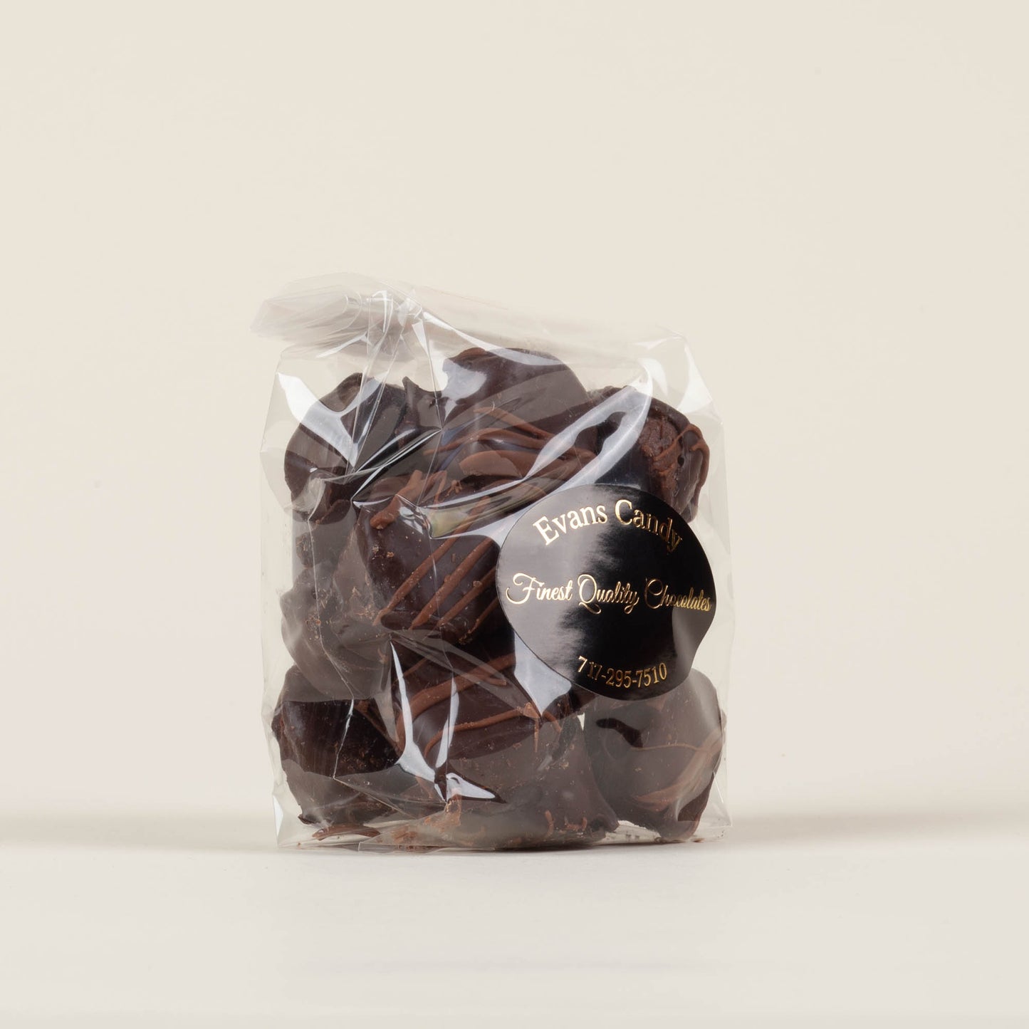 Eight-ounce bag of Evans Candy Dark Chocolate Espresso Truffles on a light background, handmade dark chocolate espresso truffles made in Lancaster, PA.