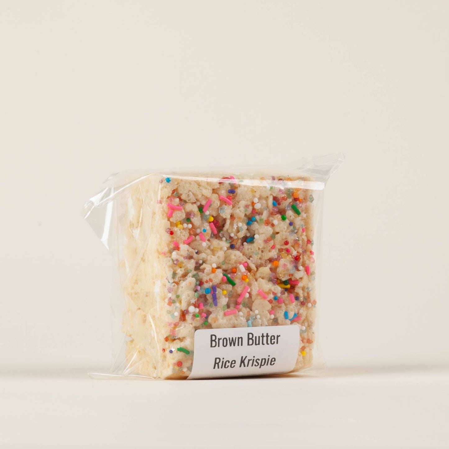 Salt and Light Pastry Co. oversized brown butter Festive Krispie treat with festive sprinkles on a light background, handmade by pastry chef Ruby Shenk in Lancaster City, PA.