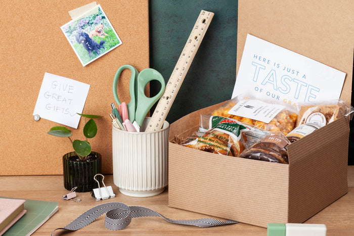 A premium FINRA compliant client gift box for wealth managers. Small-batch Pennsylvania pretzels, caramel popcorn & mustard curated under the new $300 limit.