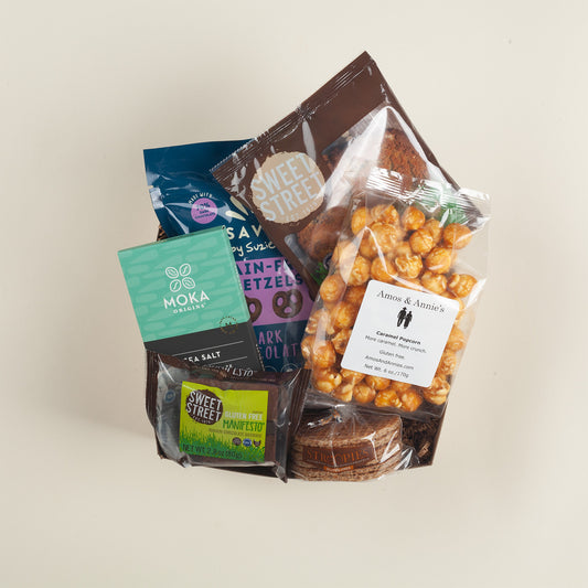 A thoughtful gluten-free Pennsylvania gift box with golden caramel popcorn, toffee cookies, crunchy grain-free pretzels, decadent brownie, chewy stroopwafels & rich sea salt chocolate.