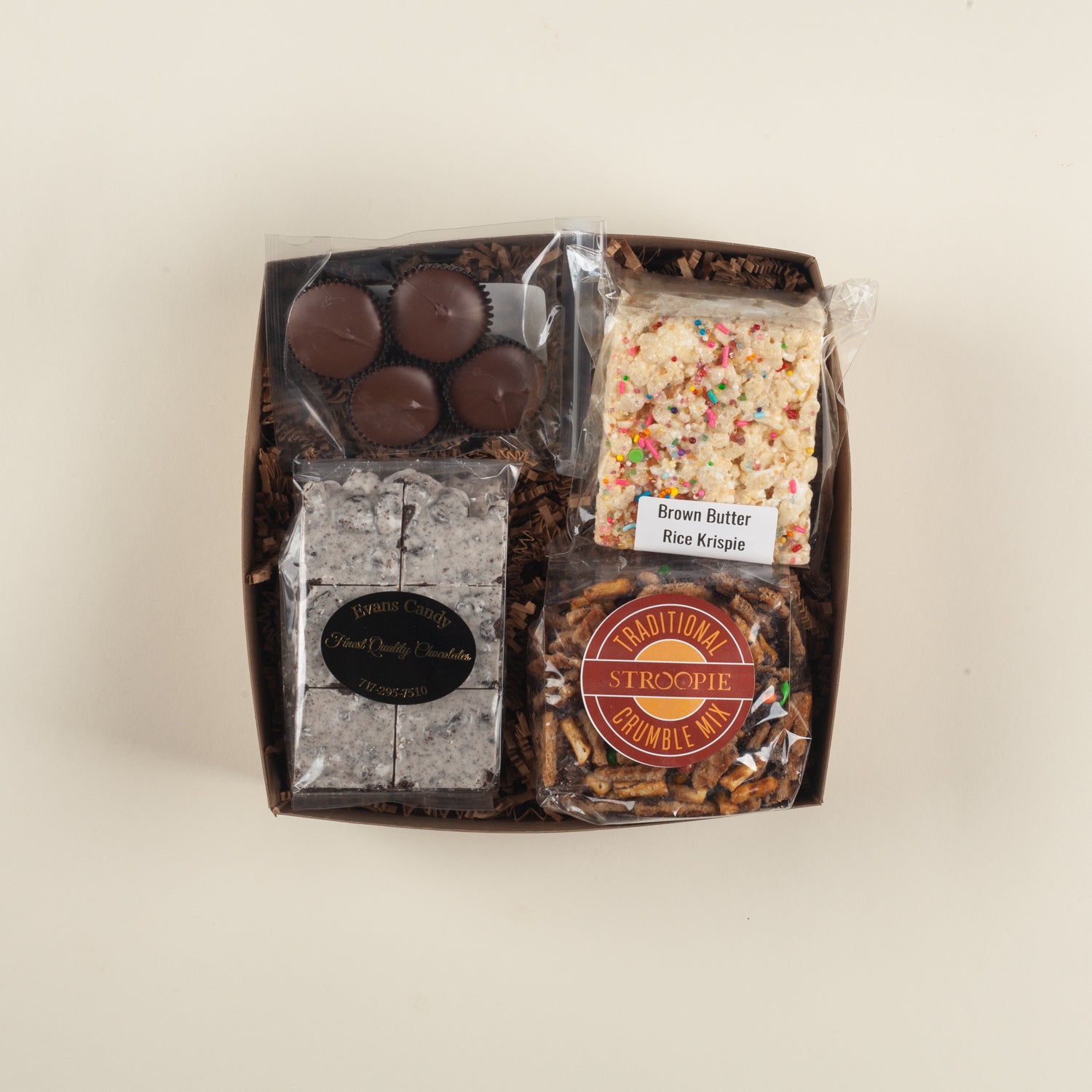 A fun Pennsylvania birthday or thank-you gift box packed with PB cups, Rice Krispie treats, cookies & cream bark and stroopie crumble mix.