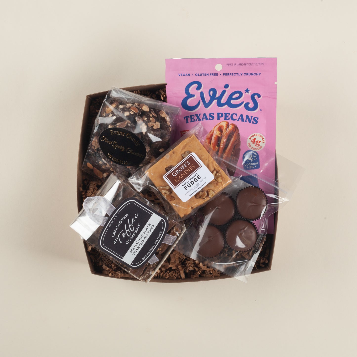 Indulgent Pennsylvania nut gift box with buttery almond toffee, maple walnut fudge, crunchy sweet & salty pecans and creamy small-batch peanut butter cups.