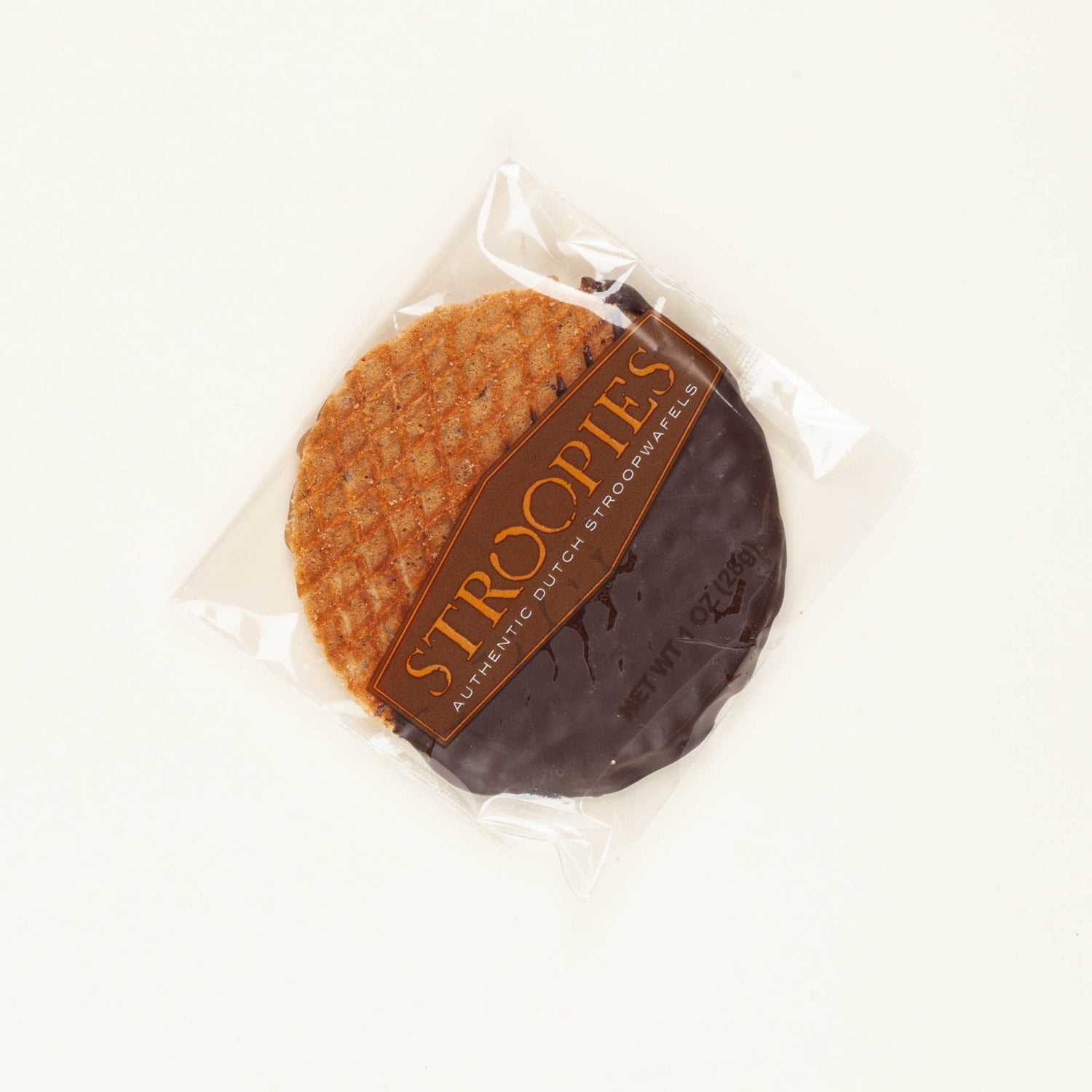 Single Stroopies espresso chocolate-dipped stroopwafel on a white background, round cinnamon waffle cookie dipped in dark chocolate with espresso grounds.