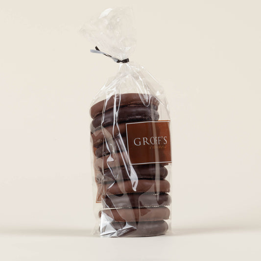 Eight-ounce bag of Groff's Candies mixed milk and dark chocolate covered pretzels on a cream background, handmade by third-generation candy makers in Lancaster, PA