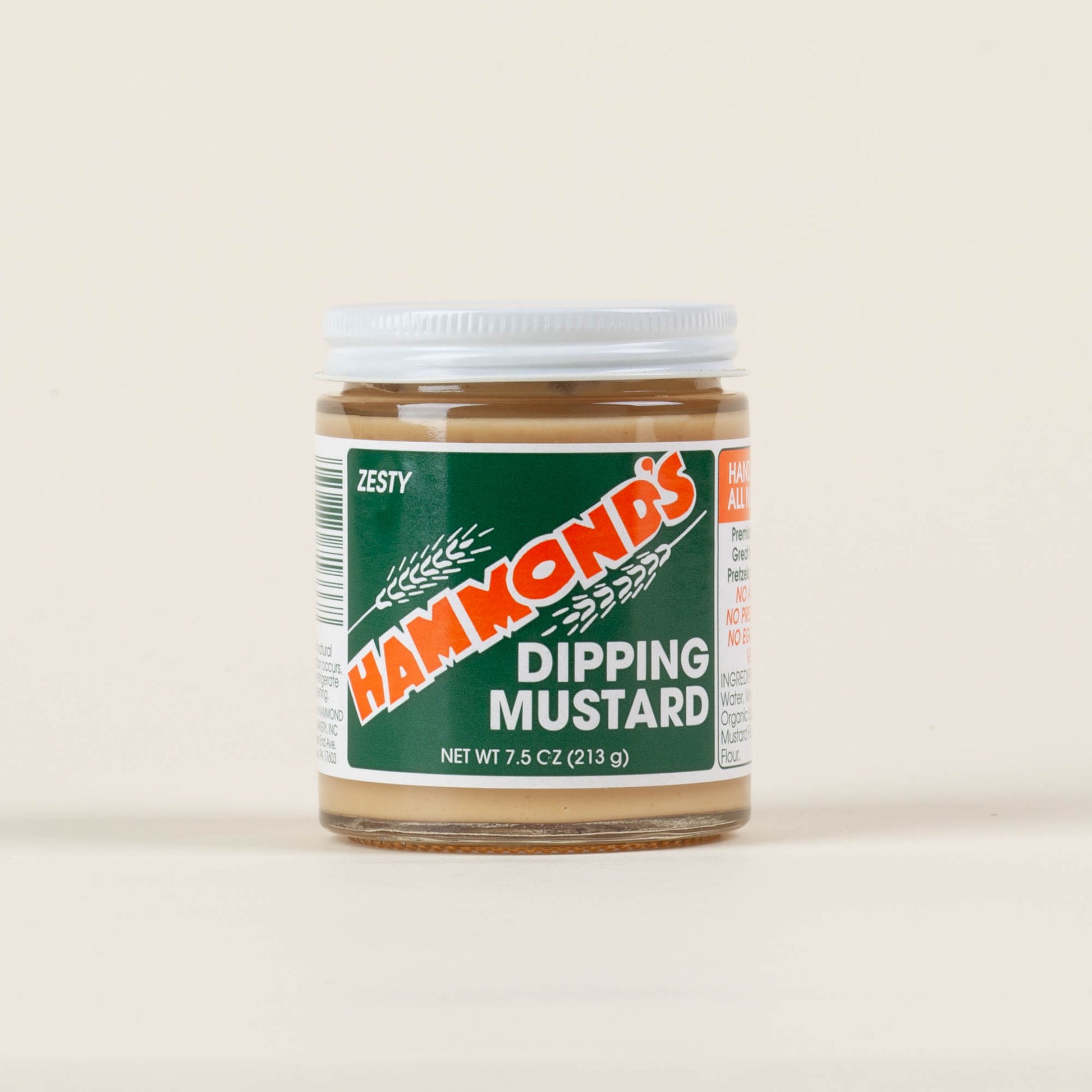 Seven-and-a-half-ounce jar of Hammond's Sweet & Zesty Dipping Mustard on a light background, handcrafted mustard made to pair with sourdough pretzels in Lancaster, PA.