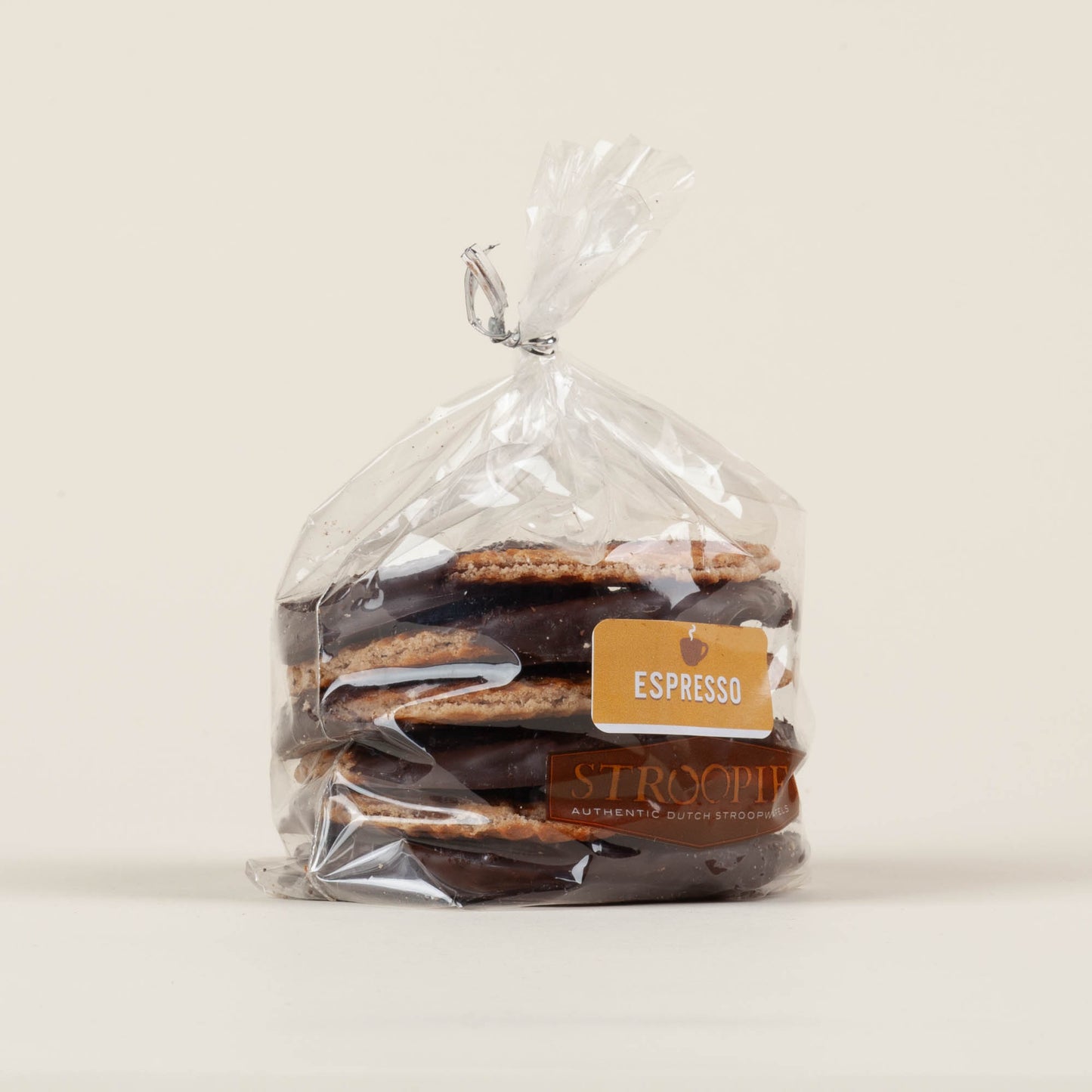 Gift pack of six espresso chocolate-dipped Stroopies stroopwafels on a white background, round cinnamon waffle cookies dipped in dark chocolate topped with ground espresso. Made in Lancaster, PA.