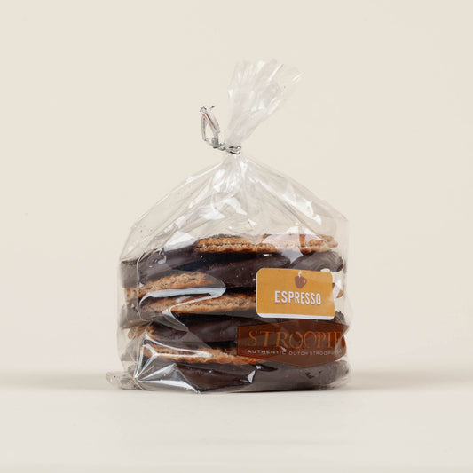 Gift pack of six espresso chocolate-dipped Stroopies stroopwafels on a white background, round cinnamon waffle cookies dipped in dark chocolate topped with ground espresso. Made in Lancaster, PA.