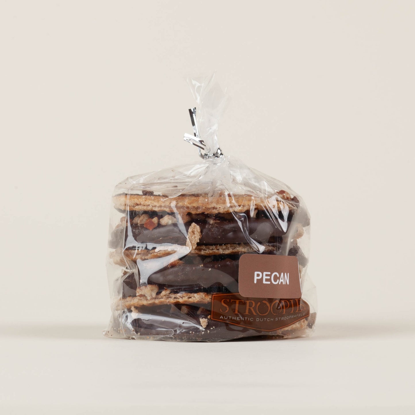 Gift pack of six pecan Stroopies stroopwafels on a white background, round cinnamon waffle cookies with caramel-pecan filling, handmade in Lancaster, PA.
