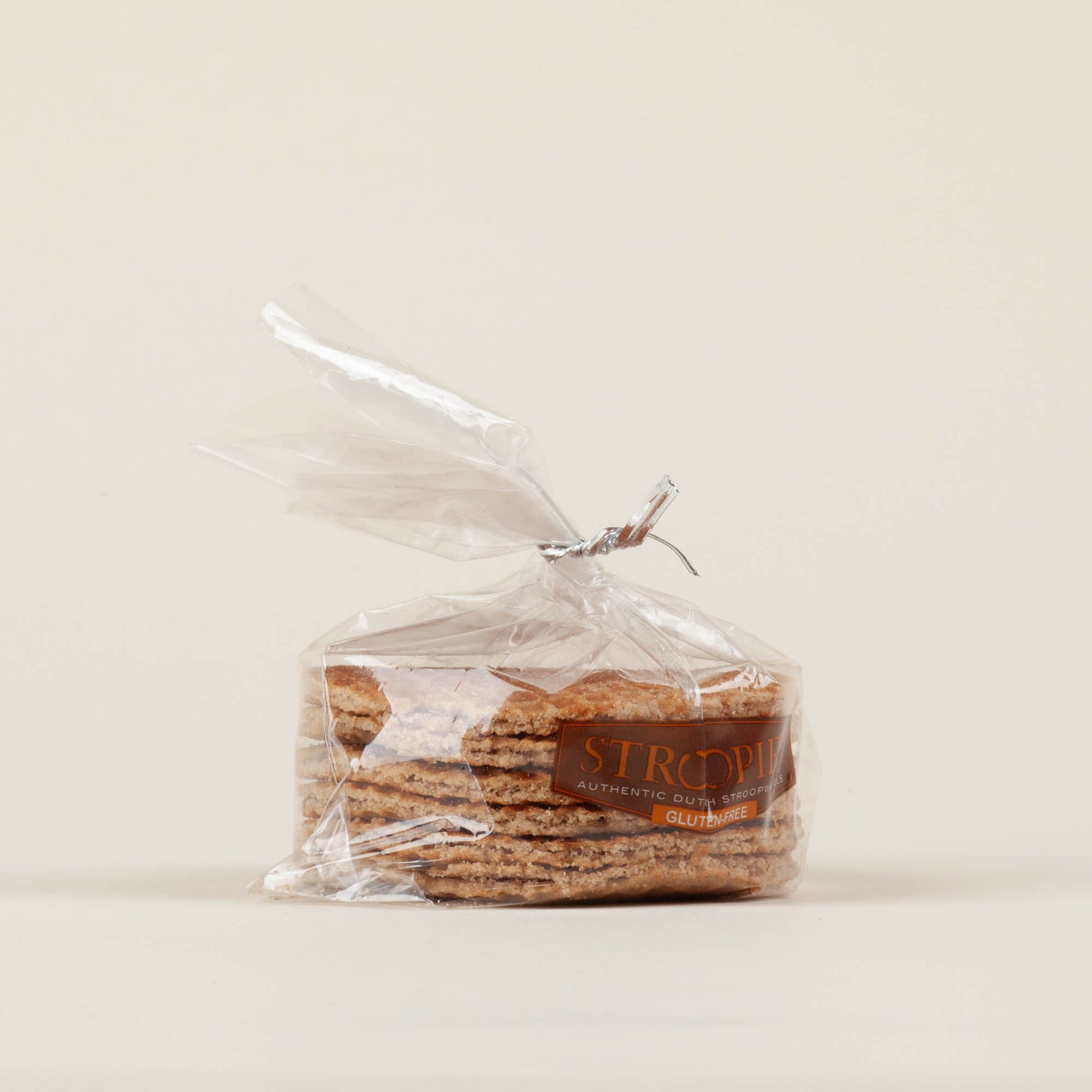 Gift pack of six gluten-free Stroopies stroopwafels on a white background, round cinnamon waffle cookies with caramel filling made in Lancaster, PA.
