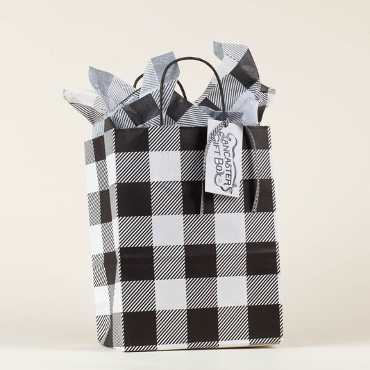 Lancaster Gift Box event bag in signature black and white gingham with gift tag on a light background. 